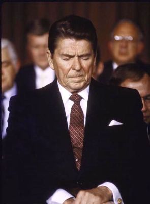 President Ronald Reagan prays. From armystrongstories.com